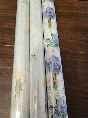 Three rolls of wrapping paper