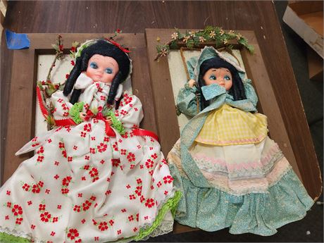 2 dolls mounted in frames