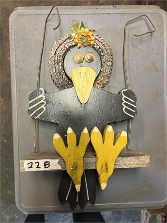 Folk art crow yard ornament.