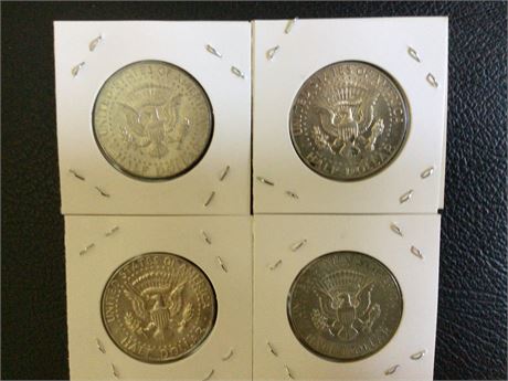 Four 1967 Kennedy Quarter coins