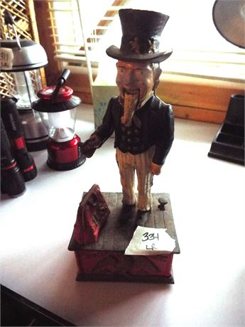 Collectible Uncle Sam Metal Bank and Metal Ship