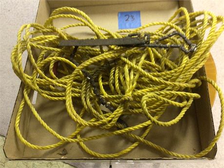Rope with Chain Saw Attached for Cutting Tree Limbs