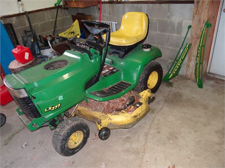 Johne Deere Tractor- They Mowed the Yard Last Year with It.