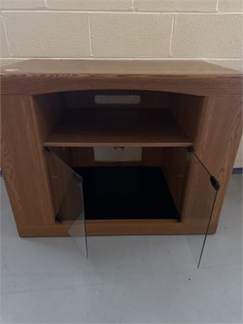 small wooden glass entertainment cabinet