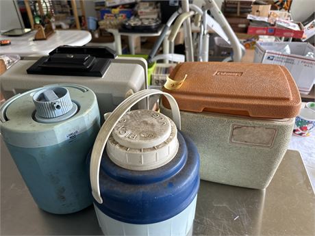 A lot of vintage coolers and water jugs