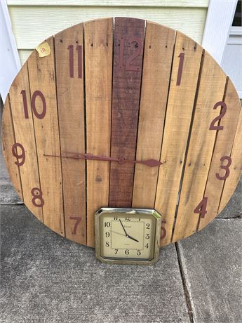 large wooden clock and small plastic clock