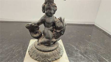 Vintage Wrought Iron Candle Holder. Child Sitting On Fish. Marble Base