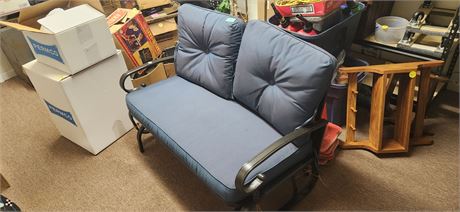 2 Seat Metal Glider With Cushions. In Good Condition