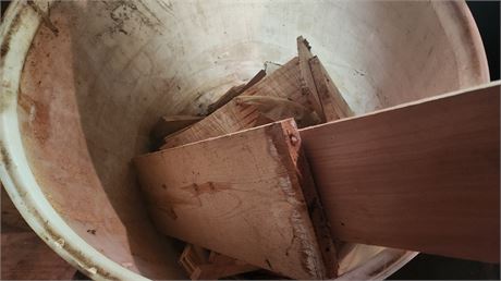 Plastic Barrel Of Wood Pieces