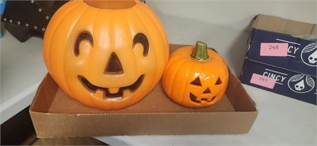 1 plastic and 1 glass pumpkin