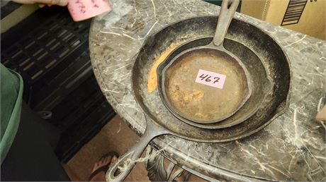 Lot Of Cast Iron Skillets. One Is Marked Wagner