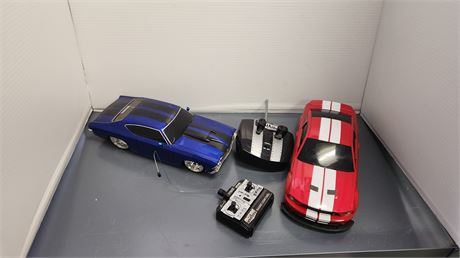 2 Remote Control Cars With Remotes. NOT TESTED
