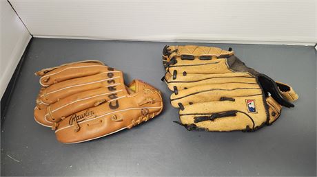 2 Baseball Mitts. One Has A Name Wrote On It