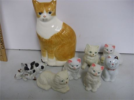 Various Cat Figurines. Large Cat Has Chip In Ear