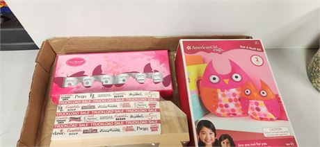 American Girl Toy, nail polish, and notepad