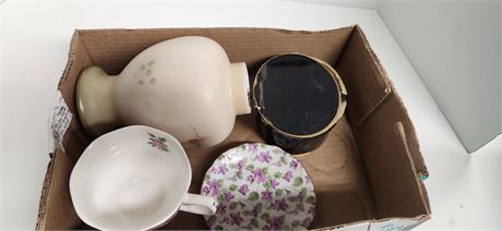 Vase, cup, and plate