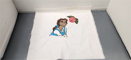 Piece Of Fabric With Belle Sewn On It