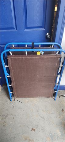 Folding Metal Cot. Shows Some Wear To Fabric