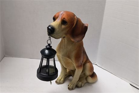 Dog Holding Light Statue