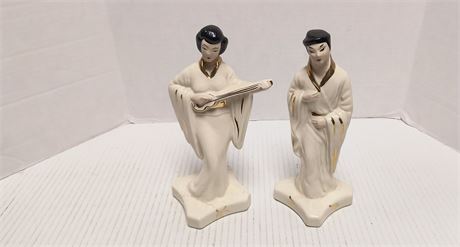 Oriental Statues. One Has Been Repaired