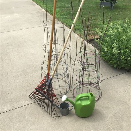 Two Rakes, Tomato Plant Cages, and Sprinkling Cans