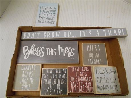 Small wooden signs with inspirational sayings
