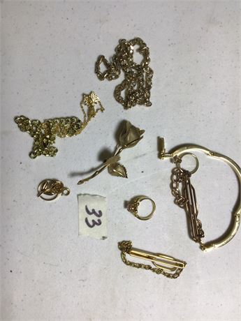 Jewelry lot with rings, necklaces, bracelets, and unique pins